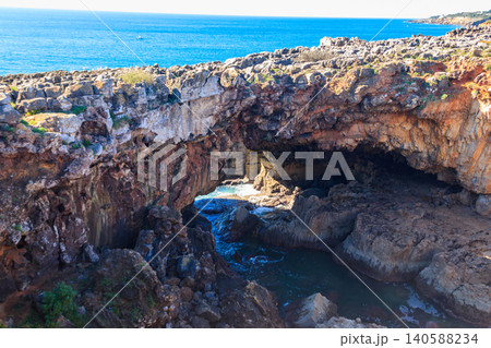 Boca do Inferno (Hell's Mouth) is a unique rock formation on the edge of the ocean in Cascais, Portugal Boca do Inferno (Hell's Mouth) is a unique rock formation on the edge of the ocean in Cascais, Portugal 140588234