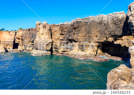 Boca do Inferno (Hell's Mouth) is a unique rock formation on the edge of the ocean in Cascais, Portugal Boca do Inferno (Hell's Mouth) is a unique rock formation on the edge of the ocean in Cascais, Portugal 140588235