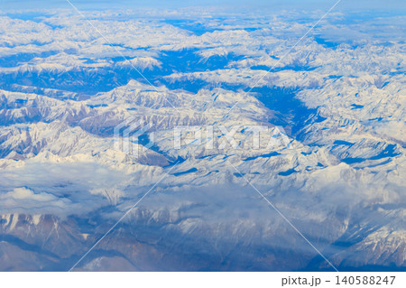 View of the Swiss Alps covered with snow from airplane View of the Swiss Alps covered with snow from airplane 140588247