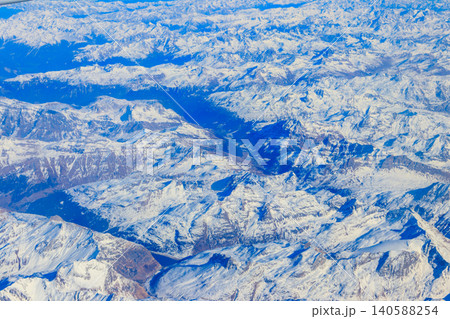 View of the Swiss Alps covered with snow from airplane View of the Swiss Alps covered with snow from airplane 140588254