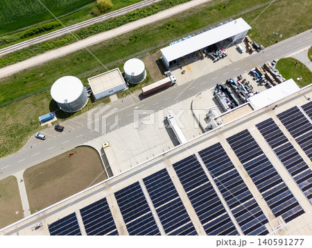 Aerial view of a modern logistics center with solar panels on the roof Aerial view of a modern logistics center with solar panels on the roof 140591277