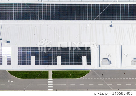 Aerial view of a modern logistics center with solar panels on the roof Aerial view of a modern logistics center with solar panels on the roof 140591400