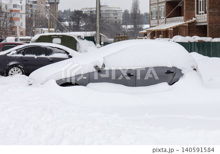 cars under the snow, winter 140591584