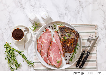 Smoked and baked pork collar on a plate Smoked and baked pork collar on a plate 140591949