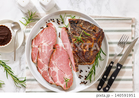 Smoked and baked pork collar on a plate Smoked and baked pork collar on a plate 140591951