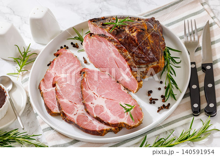 Rauch-Schweinshals pork meat is served on a plate Rauch-Schweinshals pork meat is served on a plate 140591954