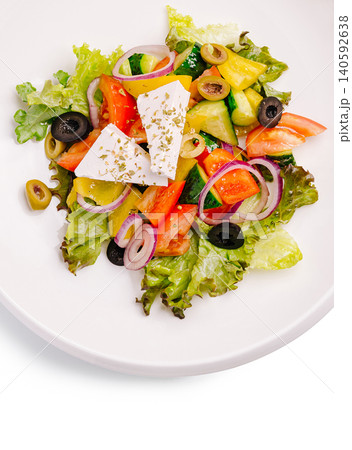 Greek salad with feta cheese and fresh vegetables Greek salad with feta cheese and fresh vegetables 140592638