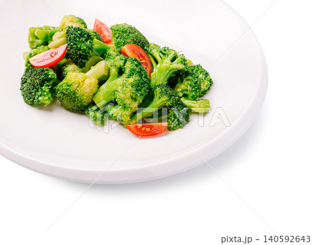 Fresh broccoli and tomato salad on white plate 140592643