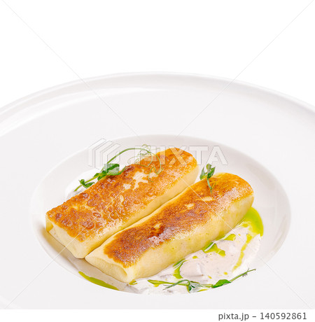 Golden fried stuffed crepes served with sauce and greens Golden fried stuffed crepes served with sauce and greens 140592861
