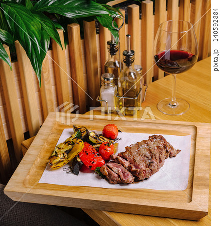Grilled steak with roasted vegetables and red wine dinner Grilled steak with roasted vegetables and red wine dinner 140592884
