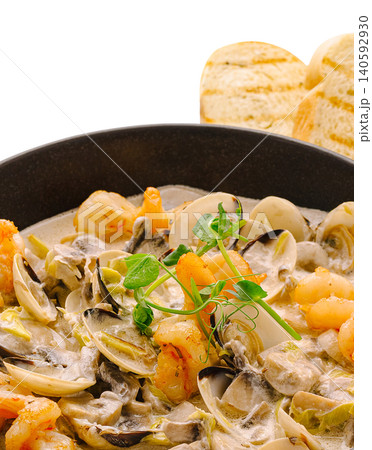 Seafood dish with clams shrimp mushrooms creamy sauce Seafood dish with clams shrimp mushrooms creamy sauce 140592930