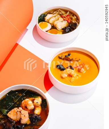 Assortment of hot asian soups with seafood and chicken Assortment of hot asian soups with seafood and chicken 140592945