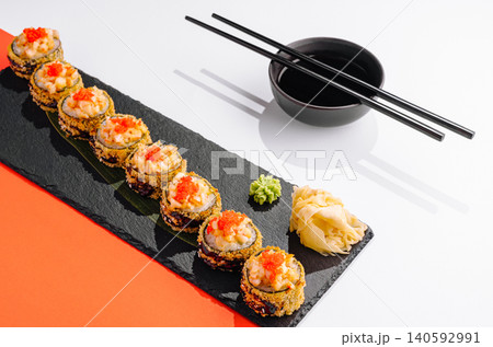 Tempura sushi rolls with roe, ginger, wasabi, and soy sauce Tempura sushi rolls with roe, ginger, wasabi, and soy sauce 140592991
