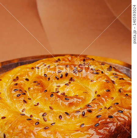 Spiral banitsa pie topped with flax seeds Spiral banitsa pie topped with flax seeds 140593024