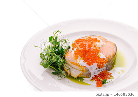 Grilled salmon steak with red caviar topping Grilled salmon steak with red caviar topping 140593036