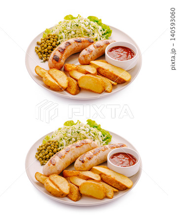 Grilled sausages with potato wedges and salad Grilled sausages with potato wedges and salad 140593060