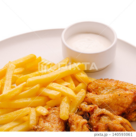 Crispy french fries with fried chicken wings 140593061