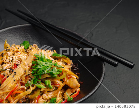 Stir fried udon noodles with tender chicken Stir fried udon noodles with tender chicken 140593078