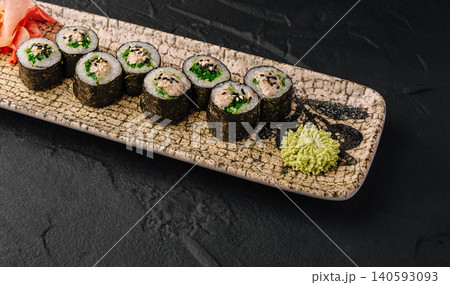 Gourmet maki sushi rolls with seaweed salad Gourmet maki sushi rolls with seaweed salad 140593093