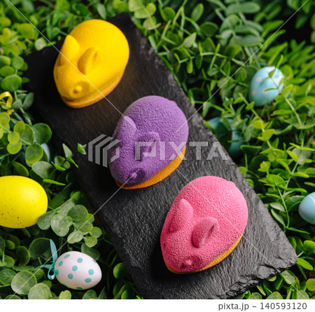 Easter bunny mousse cakes on slate board Easter bunny mousse cakes on slate board 140593120