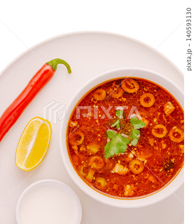 Traditional solyanka meat soup with olives and lemon 140593130