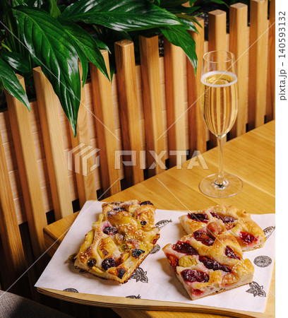 Sweet berry focaccia slices with sparkling wine Sweet berry focaccia slices with sparkling wine 140593132