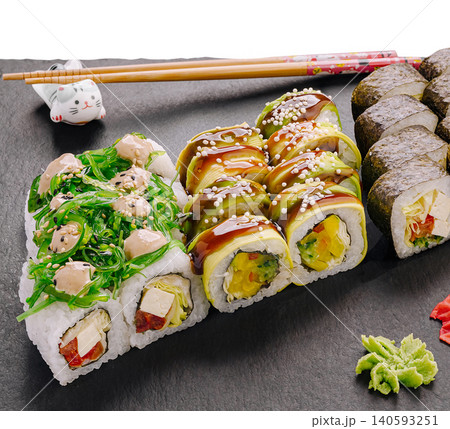Assorted vegan sushi rolls set on slate 140593251