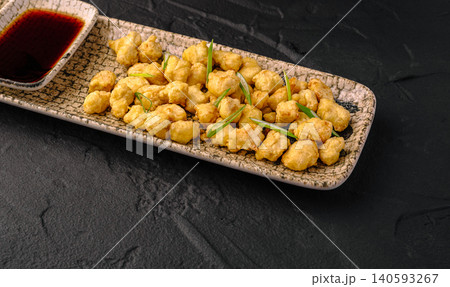 Crispy popcorn chicken bites with soy sauce Crispy popcorn chicken bites with soy sauce 140593267