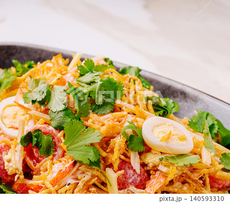 Colorful salad with noodles, eggs, and herbs served in a bowl Colorful salad with noodles, eggs, and herbs served in a bowl 140593310