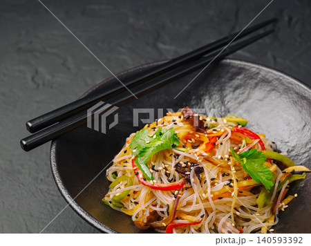 Stir fried funchosa glass noodles with vegetables Stir fried funchosa glass noodles with vegetables 140593392