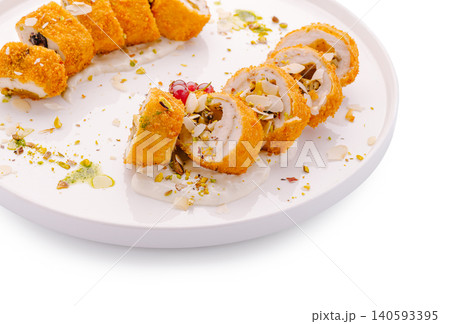 Baked chicken cordon bleu roll with nuts Baked chicken cordon bleu roll with nuts 140593395