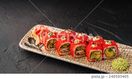 Sushi rolls with red fish roe served on a plate with ginger and wasabi Sushi rolls with red fish roe served on a plate with ginger and wasabi 140593405