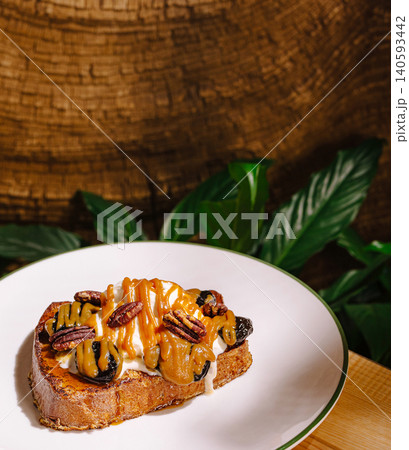 Sweet french toast with caramel and pecans Sweet french toast with caramel and pecans 140593442