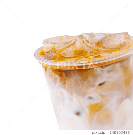 Iced coffee beverage served in clear cup with ice and cream on top Iced coffee beverage served in clear cup with ice and cream on top 140593488