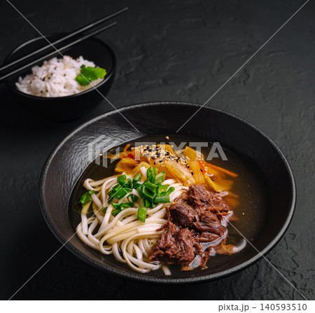 Asian Beef Noodle Soup With White Rice Side Asian Beef Noodle Soup With White Rice Side 140593510