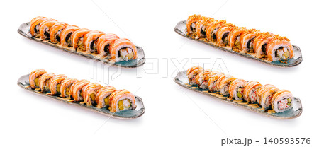 Assorted Sushi Rolls Set On Ceramic Plates 140593576