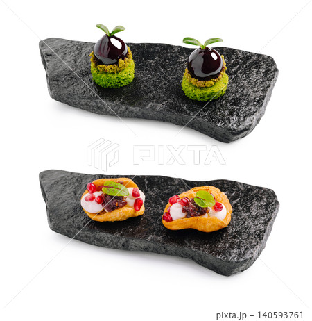 Gourmet Restaurant Appetizers Served on Black Stone Gourmet Restaurant Appetizers Served on Black Stone 140593761