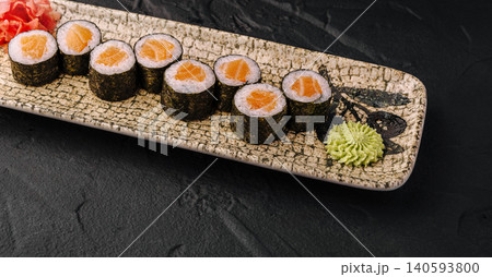 Salmon Maki Sushi Rolls on Stone Plate 140593800