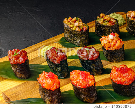 Assorted Gunkan Maki Sushi On Wooden Board Assorted Gunkan Maki Sushi On Wooden Board 140593873