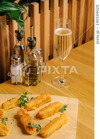 Fried Cheese Sticks With Sparkling Wine Glass Fried Cheese Sticks With Sparkling Wine Glass 140594020
