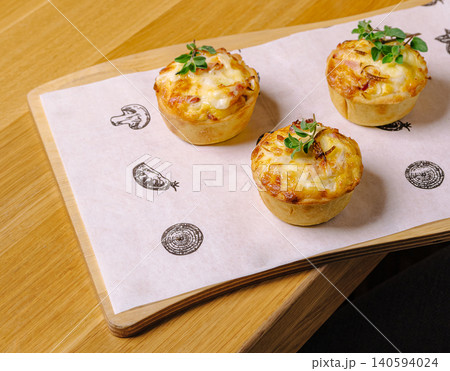 Mini Savory Quiche Tartlets With Melted Cheese 140594024