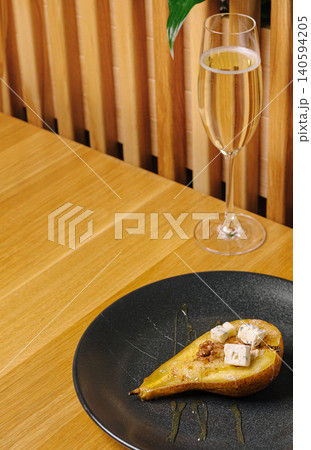 Sweet dessert with sparkling drink on table in restaurant setting Sweet dessert with sparkling drink on table in restaurant setting 140594205
