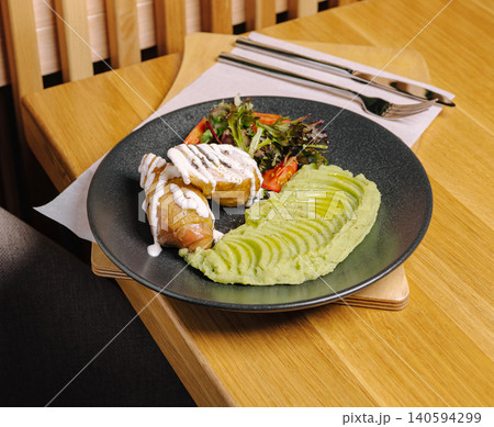 turkey meat with avocado puree is served on a plate turkey meat with avocado puree is served on a plate 140594299