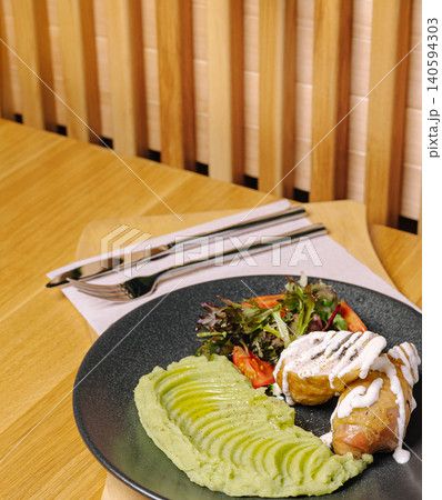Baked Meat Rolls Served With Green Mashed Potatoes 140594303