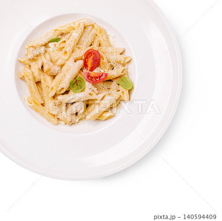 Pasta dish served on a white plate with fresh ingredients and cheese on top 140594409