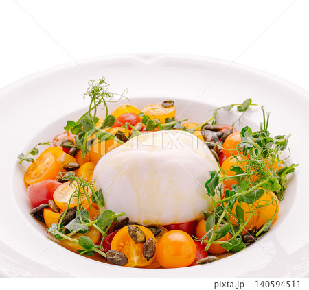 Fresh salad with burrata cheese and cherry tomatoes in a bowl Fresh salad with burrata cheese and cherry tomatoes in a bowl 140594511
