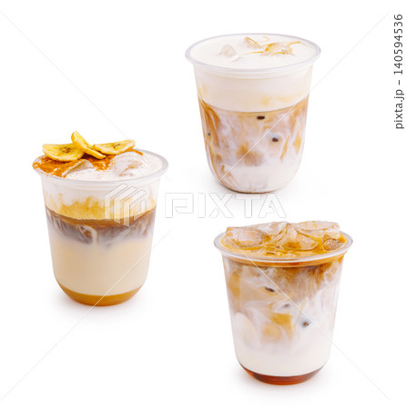 Three cups of iced coffee with cream and toppings on a white background Three cups of iced coffee with cream and toppings on a white background 140594536
