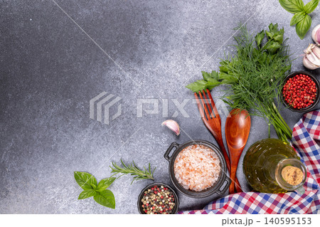 Cooking ingredients and fresh herbs on a dark background Cooking ingredients and fresh herbs on a dark background 140595153