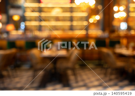 Blurred interior of a restaurant with warm bokeh lights abstract background Blurred interior of a restaurant with warm bokeh lights abstract background 140595419