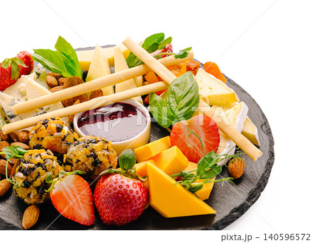 Cheese platter with fruit nuts jam and crackers Cheese platter with fruit nuts jam and crackers 140596572